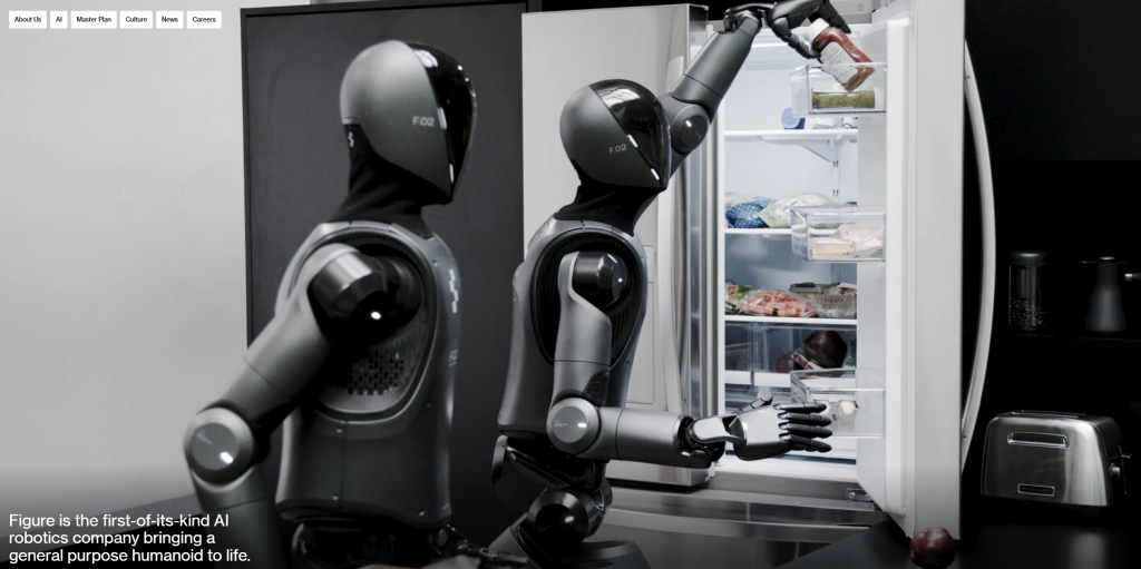 Picture of two Figure AI humanoid robots putting an item into a refrigerator.